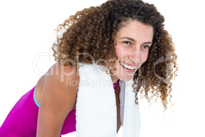Close-up of happy young woman with towel on shoulder
