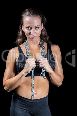 Portrait of confident woman with chain