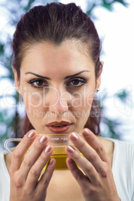 Portrait of woman holding herbal tea