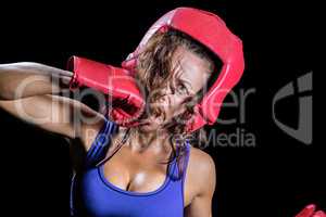 Portrait of crazy fighter punching herself