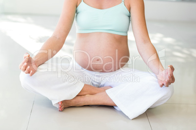 Low section of woman sitting with legs crossed