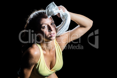 Portrait of athlete wiping sweat with towel