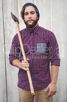 Portrait of hipster holding axe