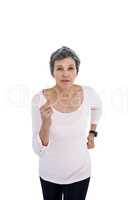 Mature woman jogging against white background
