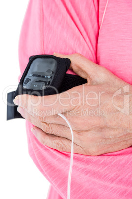 Woman holding mp3 player on armband