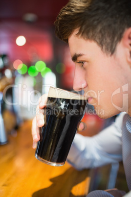 Man with drinking at bar counter