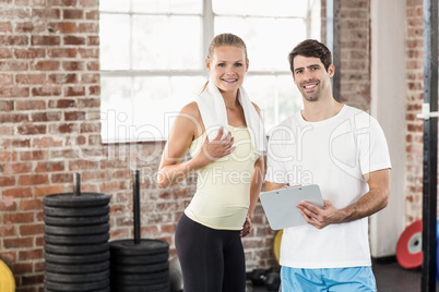 Sporty woman watching her results on clipboard