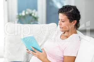 Pregnant woman reading book