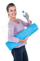 Woman holding water bottle and exercise mat