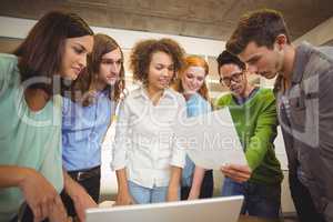 Businessman showing document to colleagues