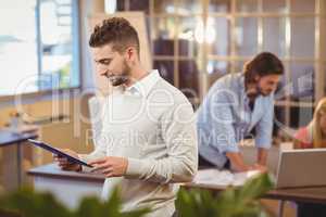 Businessman using digital PC in office