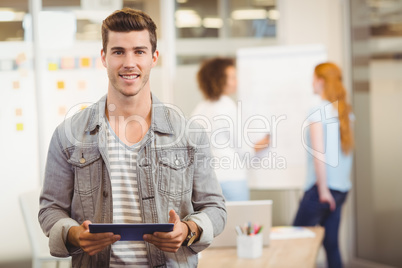 Businessman holding digital PC