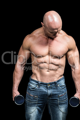 Bodybuilder exercising with dumbbells