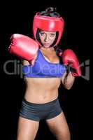 Portrait of pretty boxer with fighting stance
