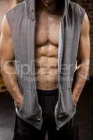 Midsection of muscular man wearing hood