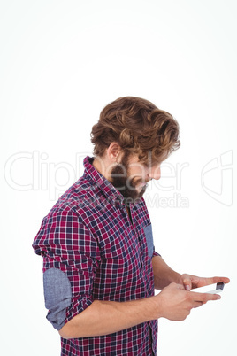 Side view of hipster using smartphone