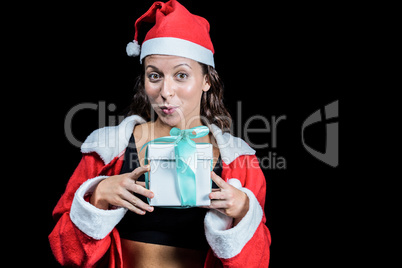 Portrait of athlete showing Christmas present