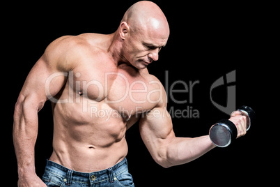 Bald man lifting dumbbells