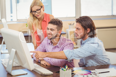 Businessman pointing on computer