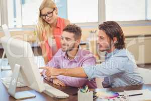 Businessman pointing on computer