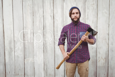 Portrait of hipster with axe