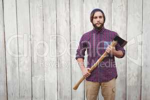Portrait of hipster with axe