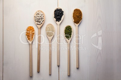 Wooden spoons of pulses and seeds