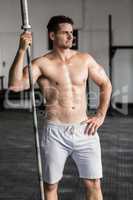 Muscular man holding barbell