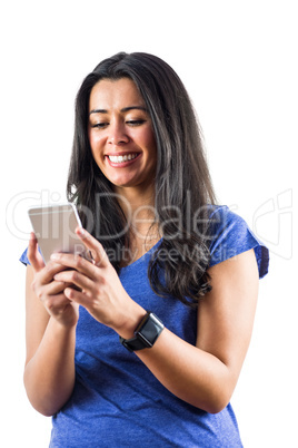 Smiling woman using a smartphoen and wearing a smartwatch