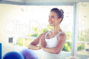 Beautiful woman smiling with hands joined