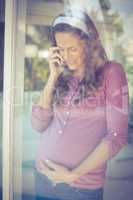 Happy woman listening to phone call
