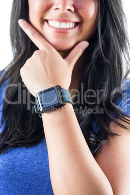 Cute woman wearing her smartwatch