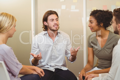 Businessman talking to colleagues