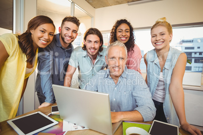 Portrait of confident business people with technologies