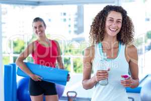 Portrait of cheerful women in fitness studio
