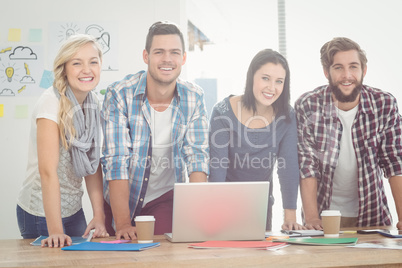 Portrait of smiling business people while standing