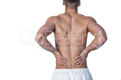 Rear view of a man undergoing back pain