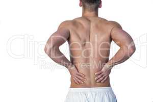 Rear view of a man undergoing back pain