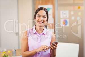 Businesswoman texting on phone