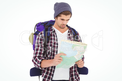 Man with luggage looking in map