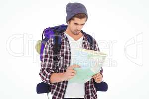Man with luggage looking in map