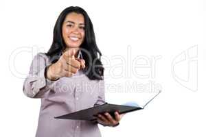 Businesswoman holding a business ledger