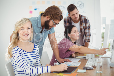 Portrait of smiling woman using digital tablet Portrait of smiling woman using digital tablet