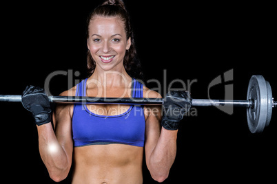 Portrait of happy woman lifting crossfit