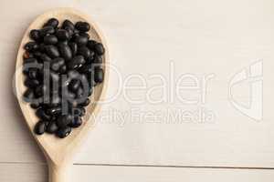 Wooden spoon of black beans