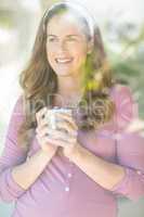Happy woman with coffee cup