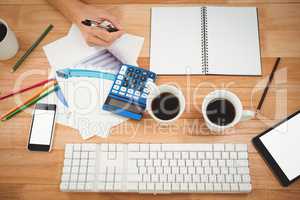 Black coffee and technologies with documents on table