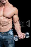 Midsection of bodybuilder exercising lifting dumbbells