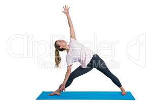 Sporty woman exercising on mat