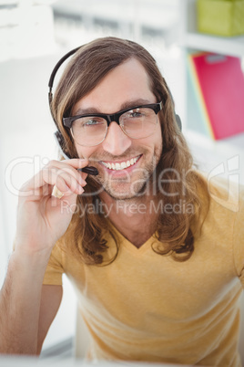 Portrait of happy hipster using microphone